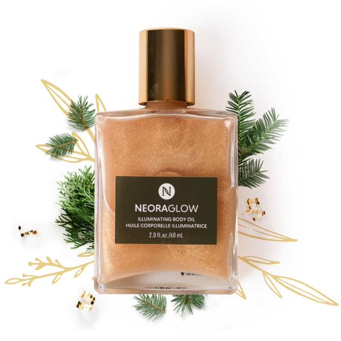 NeoraGlow Body Oil with holiday greenery